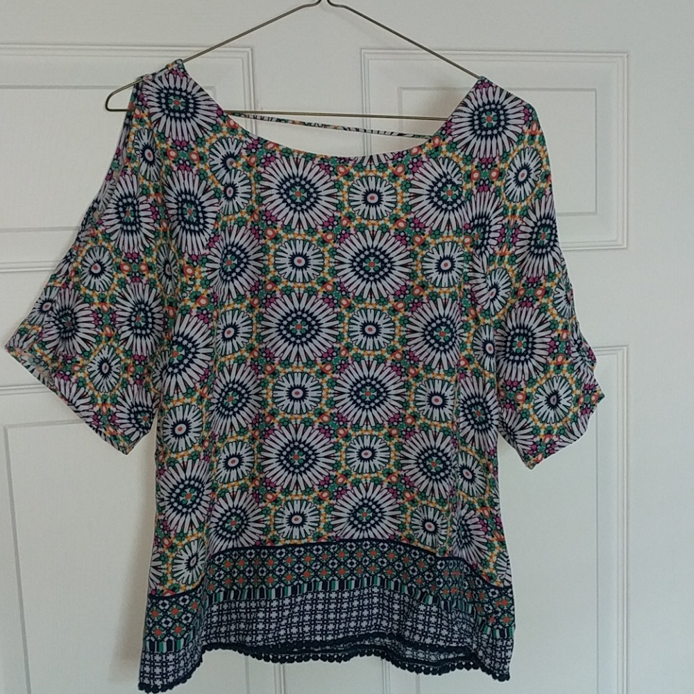 Shirt with cut out sleeves